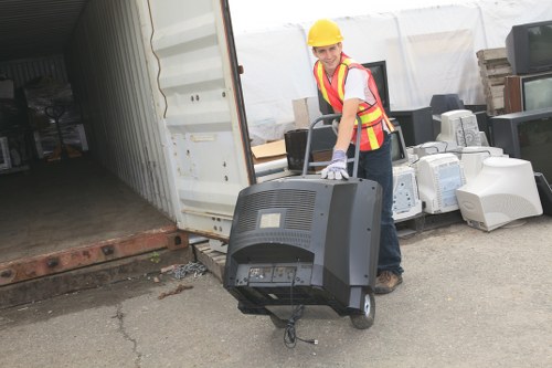 Investigator examining waste collection vehicle